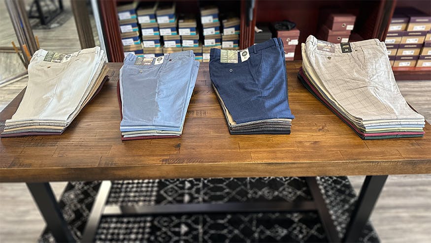 Dress pants on display table in JwR's store.